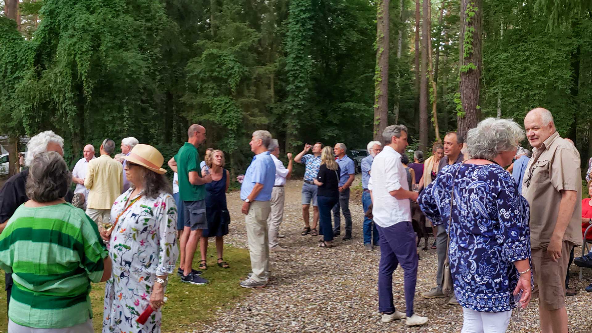 Visitors and artists gathering at the sculpture park